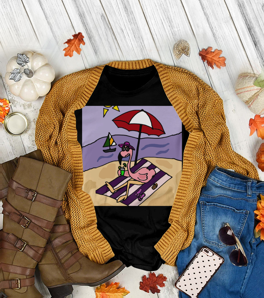 Funny Pink Flamingo Relaxing Under Umbrella at Beach with Sailboat T-Shirt