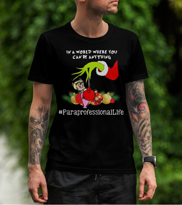 In A World Where You Can Be Anything Hand Grinch Holding Ornaments #ParaprofessionalLife T-Shirt