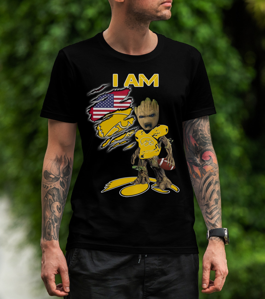 I Am Hawkeyes Baby Groot Holding Football With Usa Flag And Iowa Hawkeyes T-Shirt