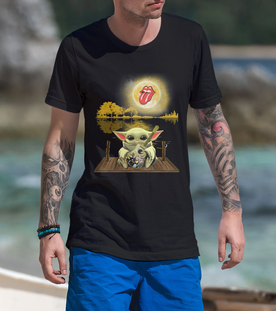 The Rolling Stones Tongue Logo And Baby Yoda With Guitar Under Moonlit Sky Trees And Lake Reflection T-Shirt