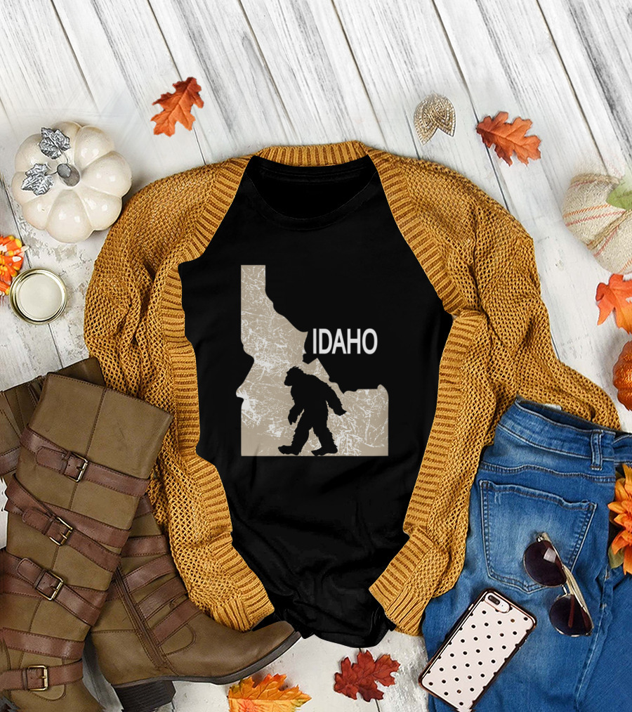 Funny Bigfoot Silhouette Walking in Idaho State Map I Believe Idaho Loves Bigfoot T-Shirt