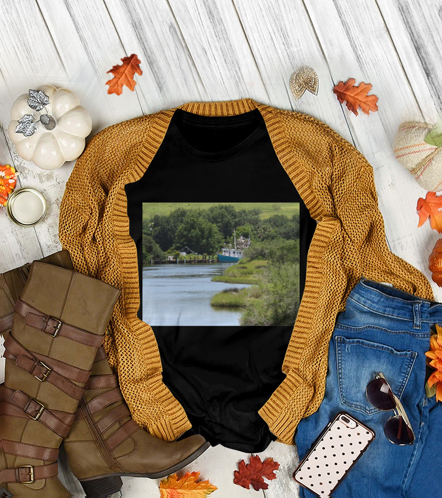 The Leslie Ann River Scene with Blue Fishing Boat and Lush Greenery T-Shirt