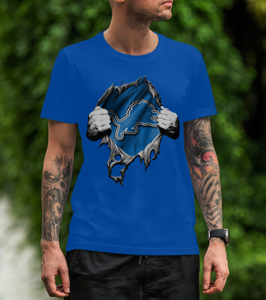 Torn Skin Revealing Detroit Lions Emblem On Blue T-Shirt