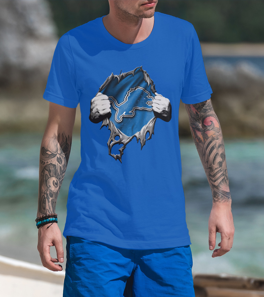 Torn Skin Revealing Detroit Lions Emblem On Blue T-Shirt