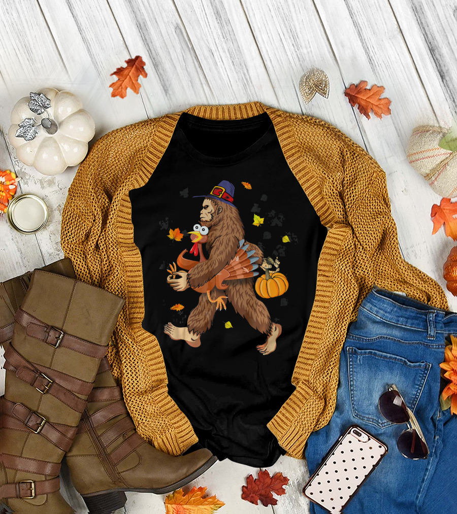 Bigfoot Sasquatch Carrying Pilgrim Hat Turkey and Pumpkin with Autumn Leaves T-Shirt