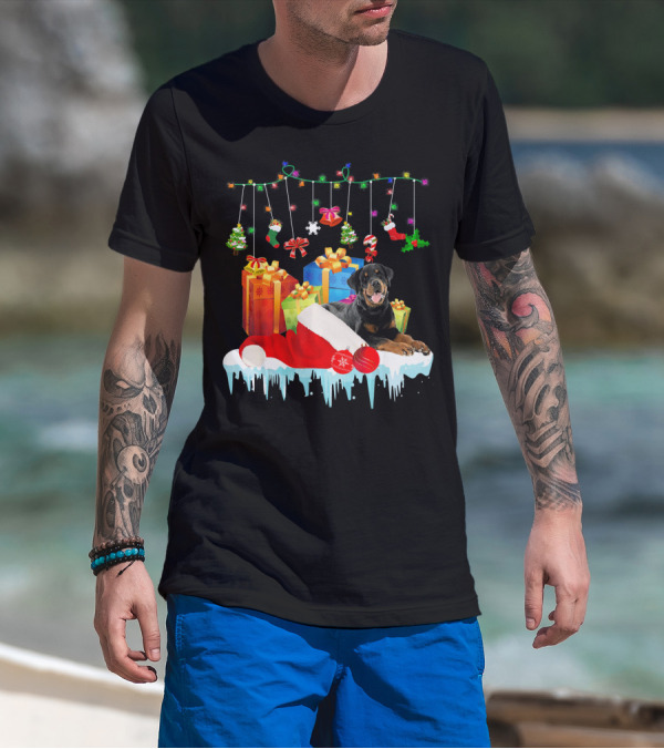 Rottweiler With Santa Hat And Christmas Gifts Under Holiday Lights T-Shirt
