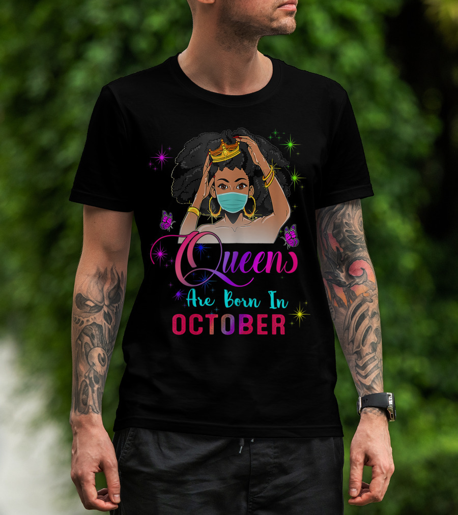Man with tattoos models Queens Are Born In October Black Girl Wearing Mask Virgo Libra Birthday T-Shirt outdoors.