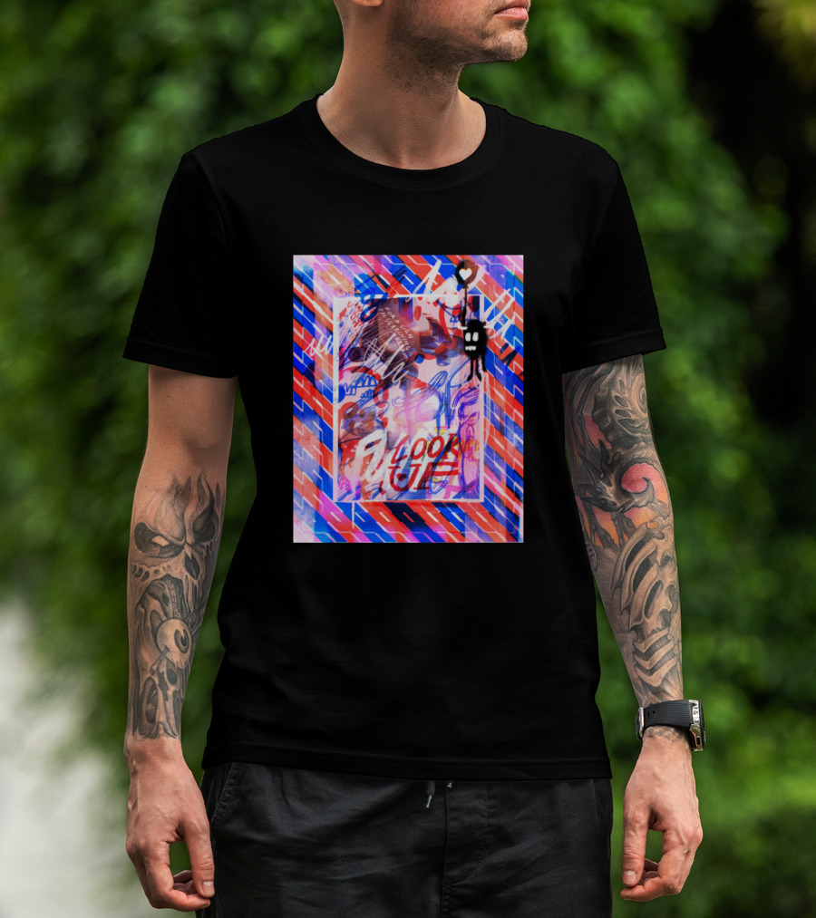 Man with tattoos models Look Up Vibrant Abstract with Heart and Skeleton T-Shirt outdoors.