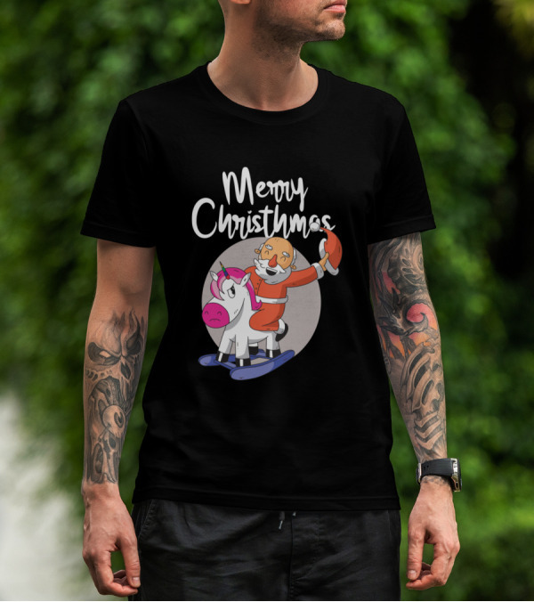 Man with tattoos models Merry Christmas Santa Riding Unicorn T-Shirt outdoors.