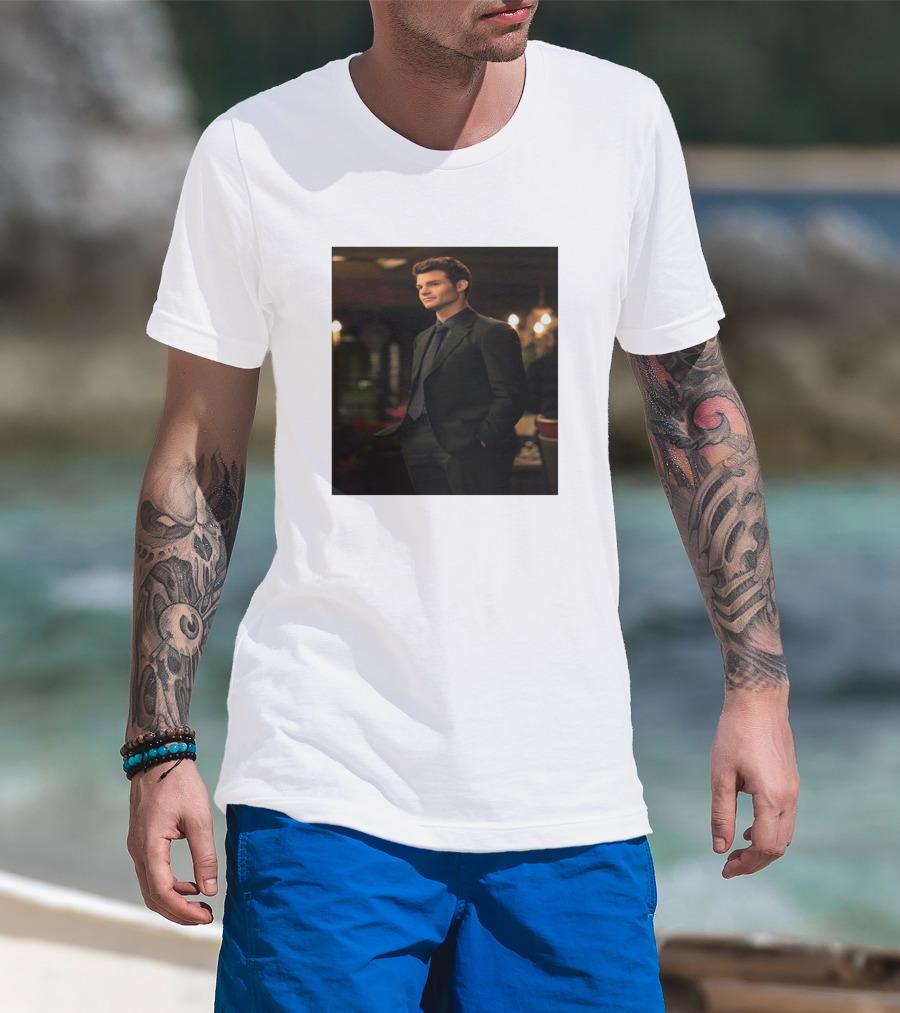 Man with tattoos models Elijah Mikaelson Vampire Diaries Suit Gentleman Scene T-Shirt at beach.