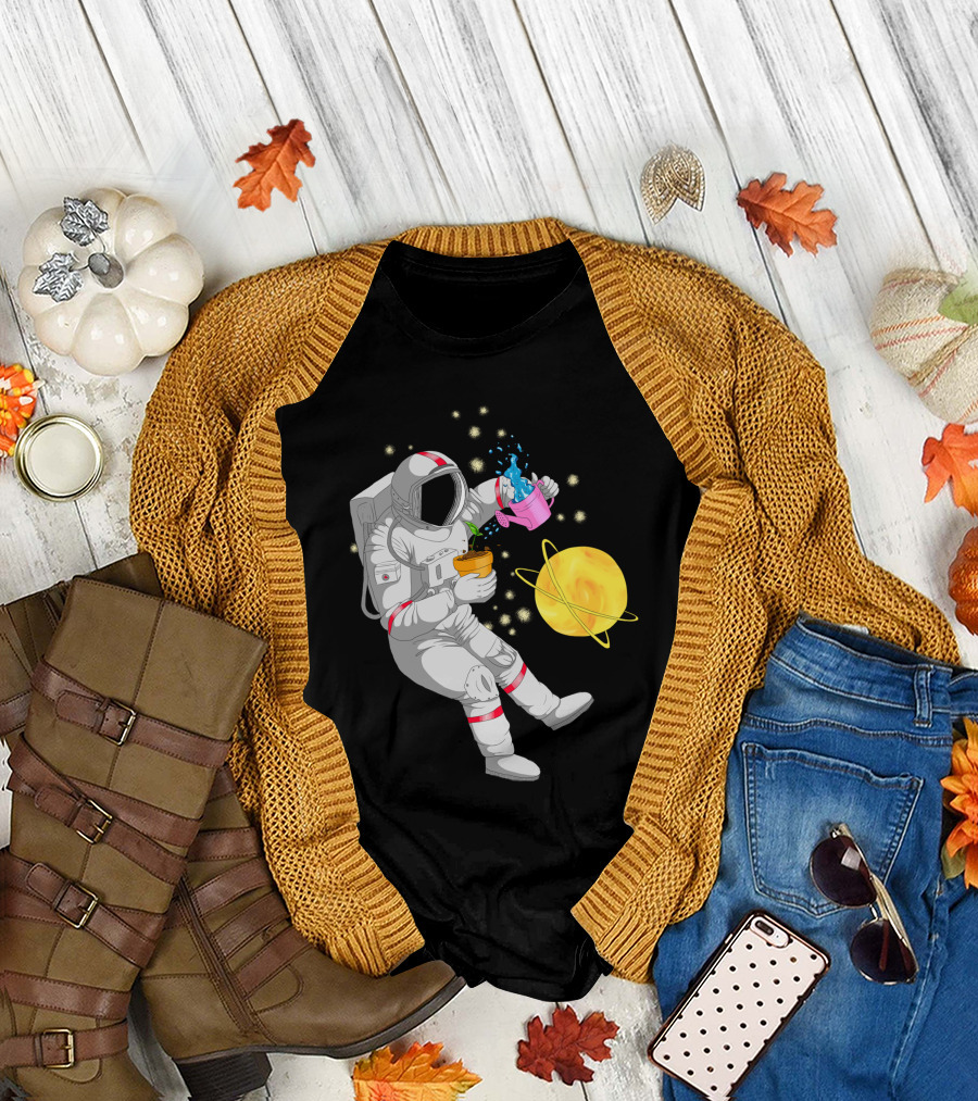 Astronaut Watering Plants in Outer Space with Cosmic Starry Background T-Shirt