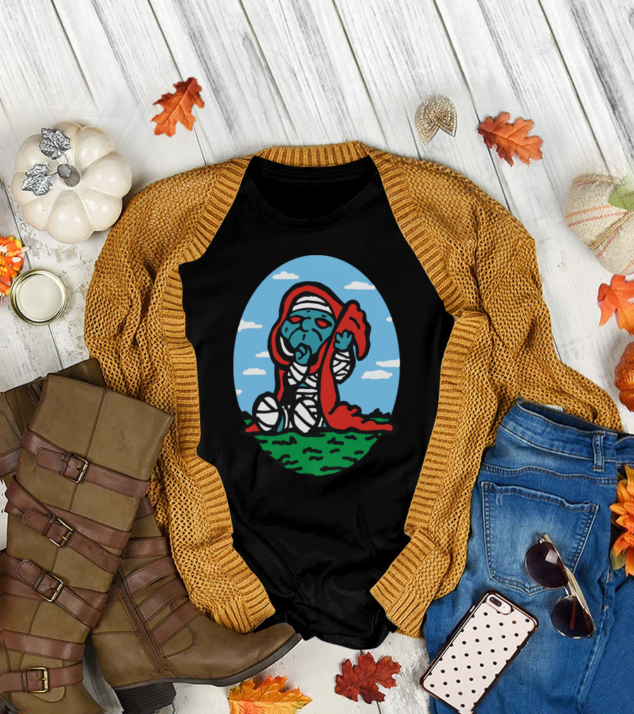 Little Mummra After A Challenging Day with Wrapped Figure and Red Cloak on Green Field T-Shirt