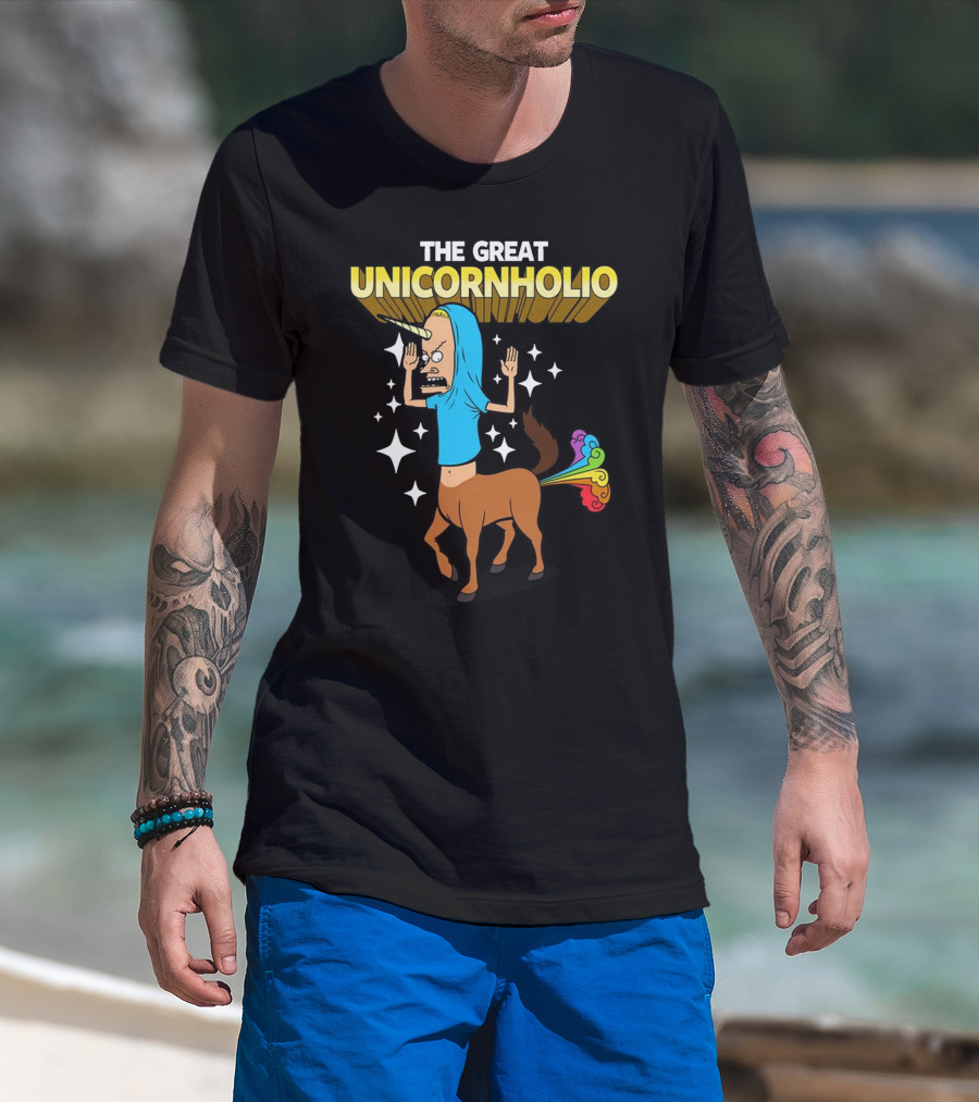 Man with tattoos models THE GREAT UNICORNHOLIO BEAVIS AND BUTT-HEAD T-Shirt at beach.
