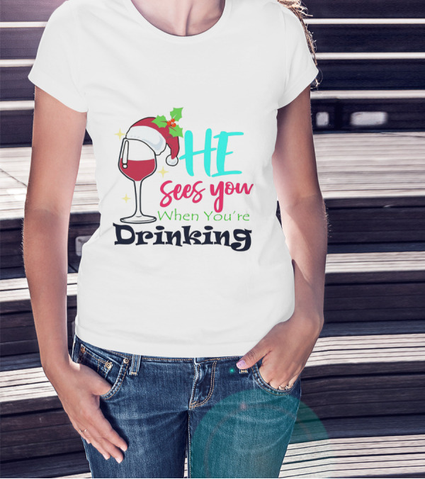 Santa Hat On Wine Glass With 'He Sees You When You're Drinking' Christmas Festive T-Shirt