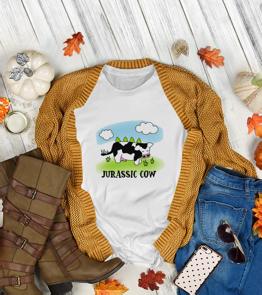 Jurassic Cow Grazing with Dinosaur Spikes Under Blue Sky and Clouds in Cartoon T-Shirt