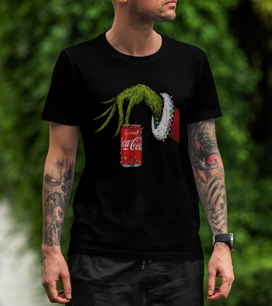 Grinch Hand Holding Coca-Cola Can Wrapped In Christmas Lights Merry Christmas T-Shirt