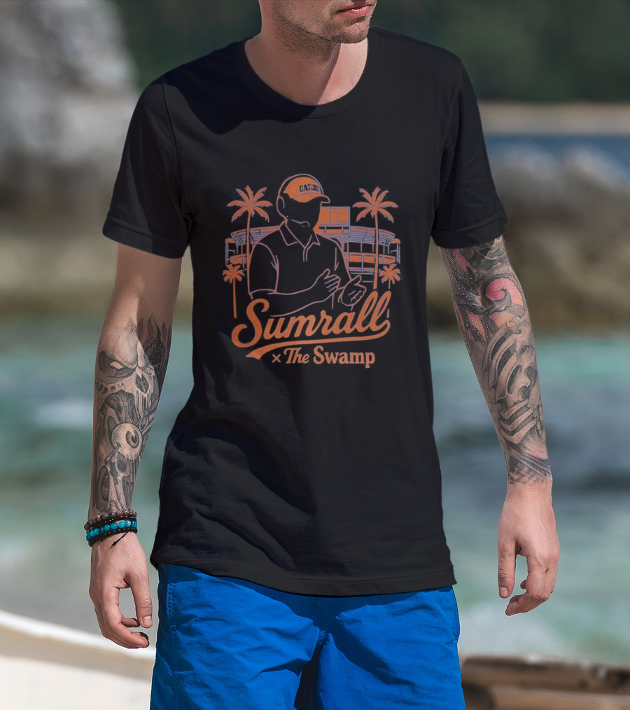 Sumrall The Swamp Coach Illustration With Palm Trees And Building Background T-Shirt
