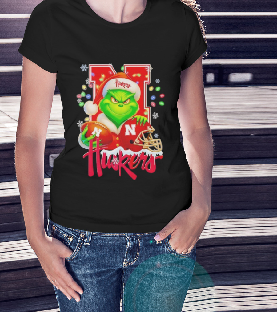 Grinch Santa With Nebraska Cornhuskers Helmet And Football Merry Christmas Huskers T-Shirt