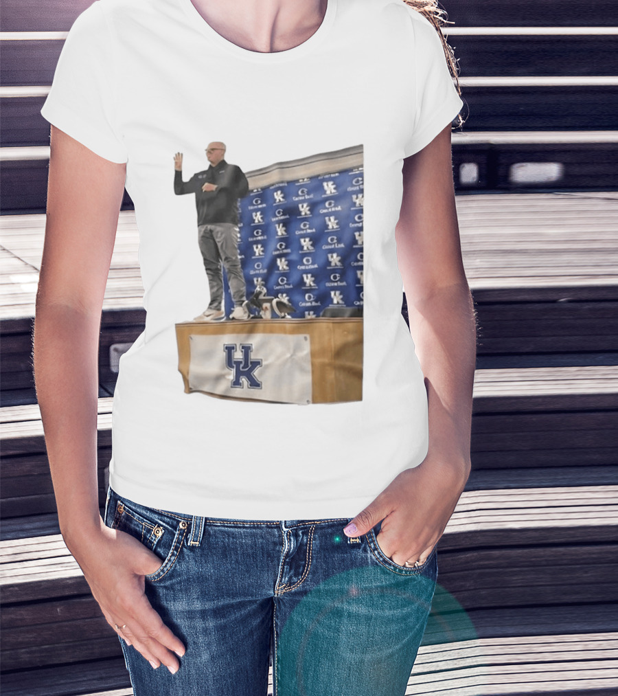UK Volleyball Coach Craig Skinner Standing On Table With UK Logo And Awards T-Shirt