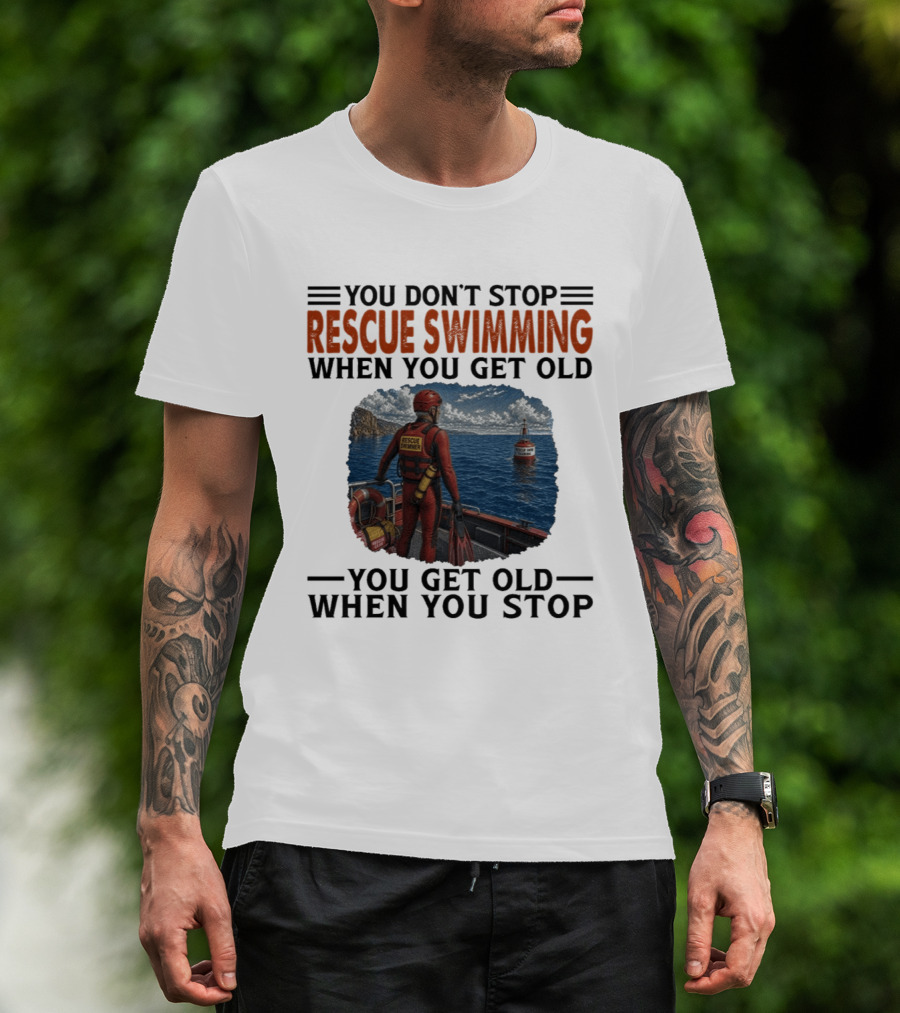 You Don't Stop Rescue Swimming When You Get Old You Get Old When You Stop Rescue Swimmer Standing On Boat Near Lighthouse T-Shirt