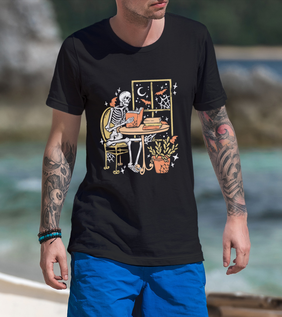 Cartoon Skeleton Reading Under Crescent Moon With Bats Orange Book Table Window T-Shirt