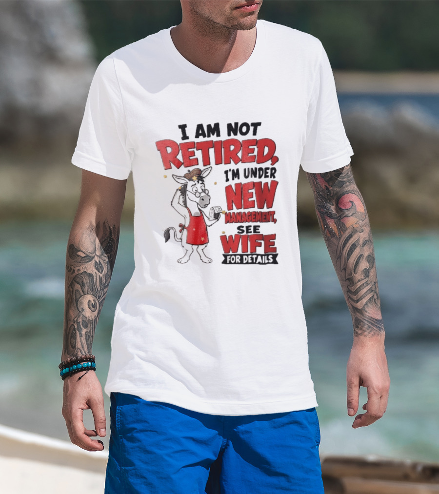 I Am Not Retired I'm Under New Management See Wife For Details Cartoon Donkey Red Apron T-Shirt