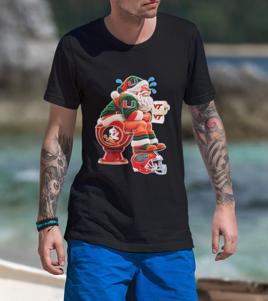 Miami Hurricanes Santa Claus Laughing On Florida State Toilet With Virginia Tech Toilet Paper And Florida Gators Helmet T-Shirt