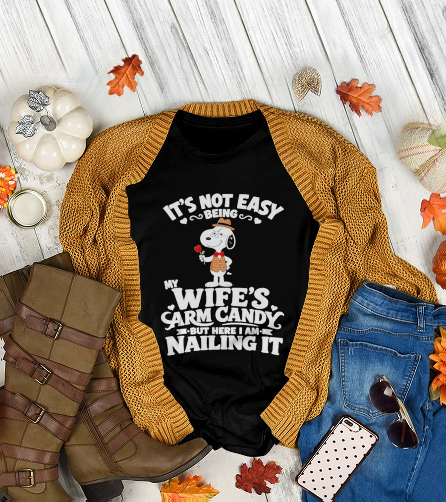 Snoopy It's Not Easy Being My Wife's Arm Candy But Here I Am Nailing It T-Shirt