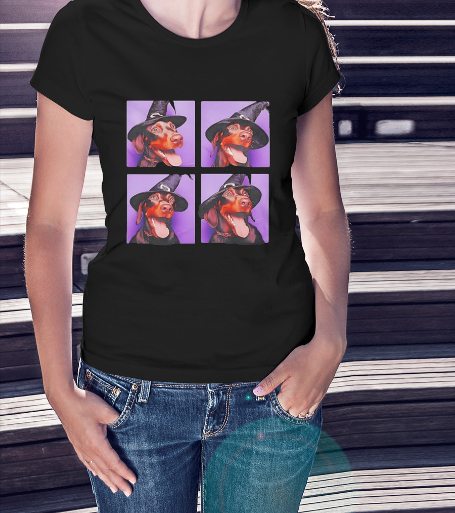 Doberman Pinscher In Witch Hat For Halloween With Purple T-Shirt