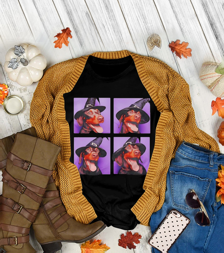 Doberman Pinscher In Witch Hat For Halloween With Purple T-Shirt