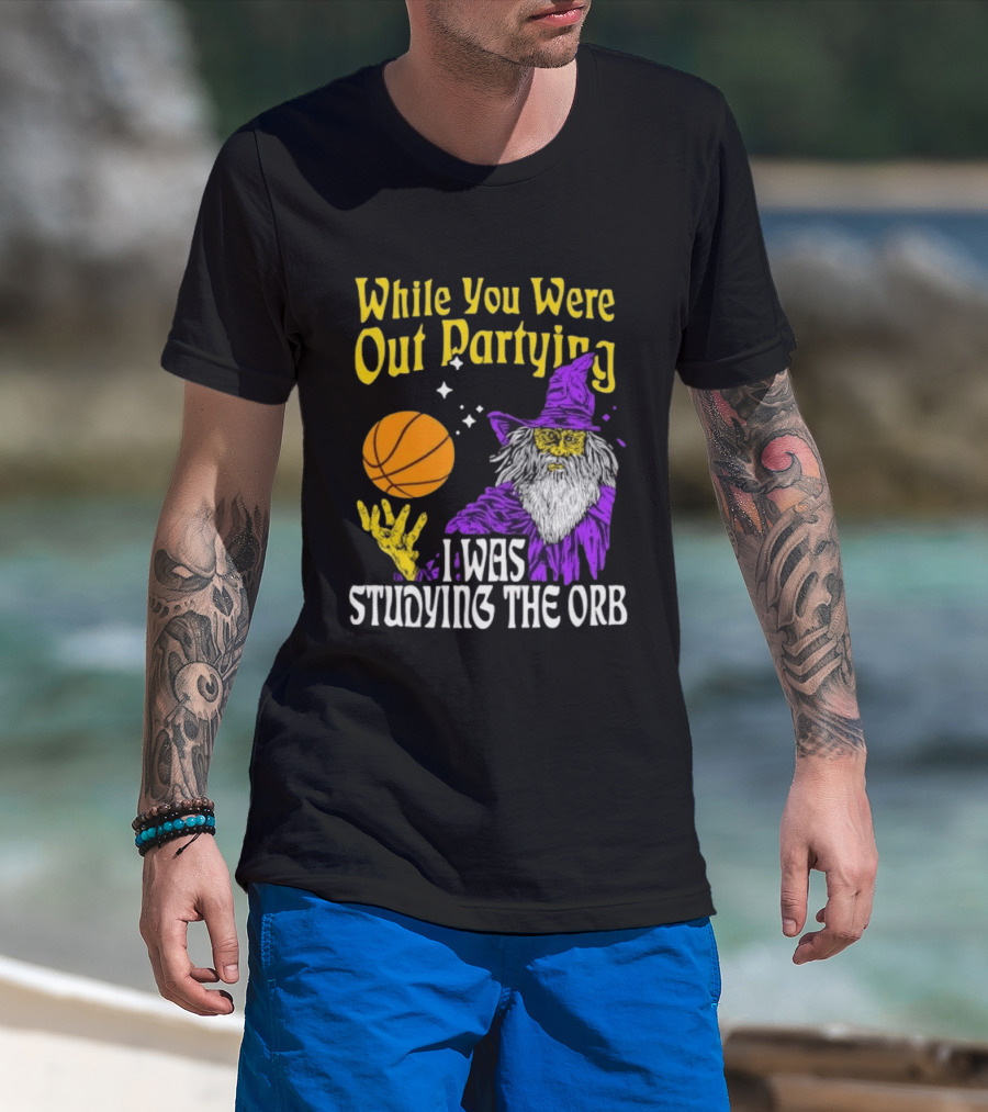While You Were Out Partying I Was Studying The Orb Wizard Basketball T-Shirt