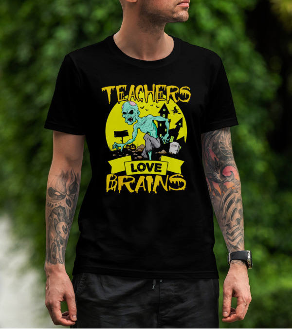 Teachers Love Brains Zombie Halloween Theme With Haunted Houses And Graveyard Background T-Shirt