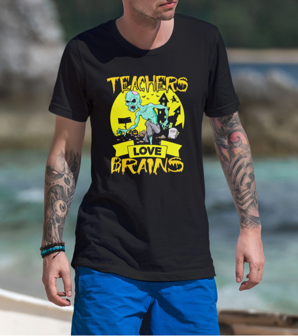 Teachers Love Brains Zombie Halloween Theme With Haunted Houses And Graveyard Background T-Shirt