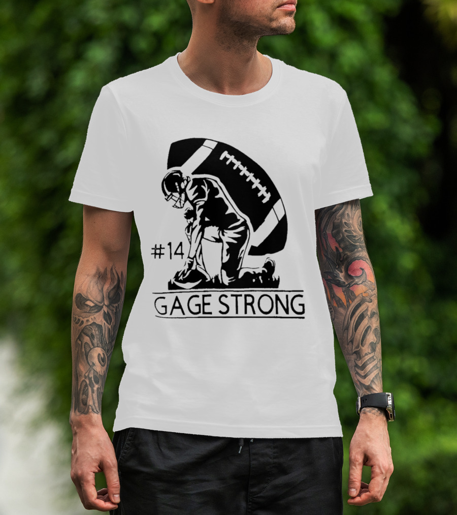 Gage Strong #14 Football Player Kneeling In Front Of Large Football T-Shirt