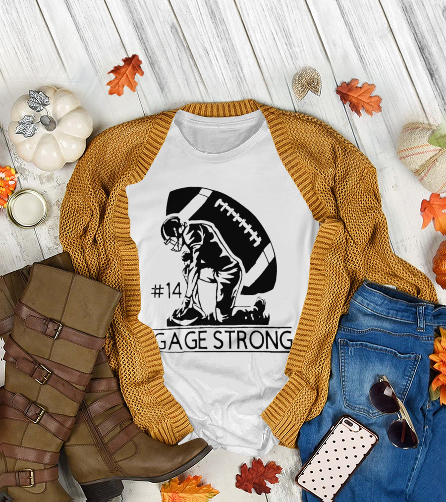 Gage Strong #14 Football Player Kneeling In Front Of Large Football T-Shirt