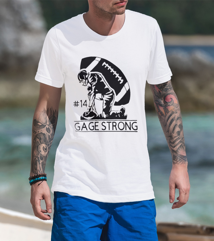 Gage Strong #14 Football Player Kneeling In Front Of Large Football T-Shirt