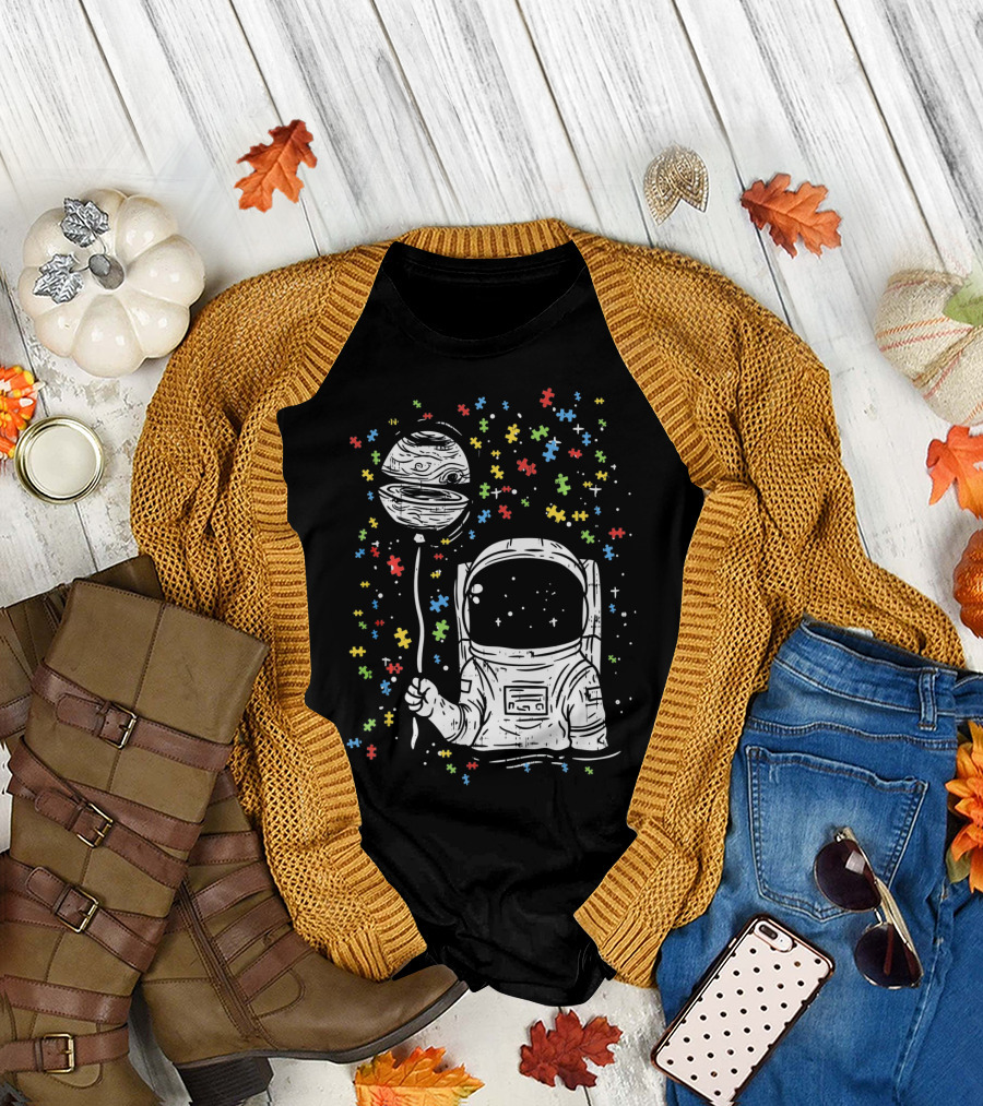 Astronaut Holding Planet Balloon with Puzzle Pieces for Autism Awareness T-Shirt