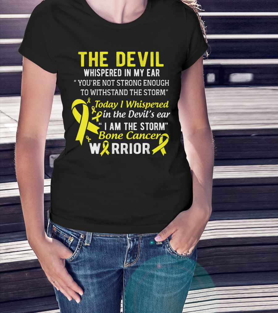 The Devil Whispered You’re Not Strong Enough To Withstand The Storm I Am The Storm Bone Cancer Warrior Yellow T-Shirt
