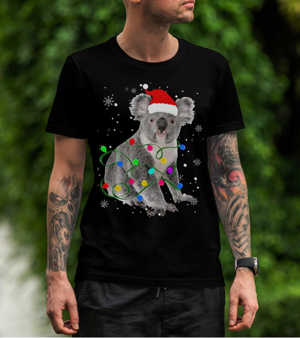 Koala Wrapped In Christmas Lights Wearing Santa Hat With Snowflakes Matching Fam T-Shirt