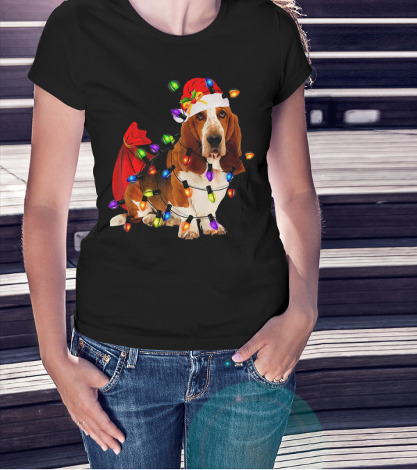 Basset Hound Wrapped In Christmas Lights With Santa Hat And Red Sack T-Shirt