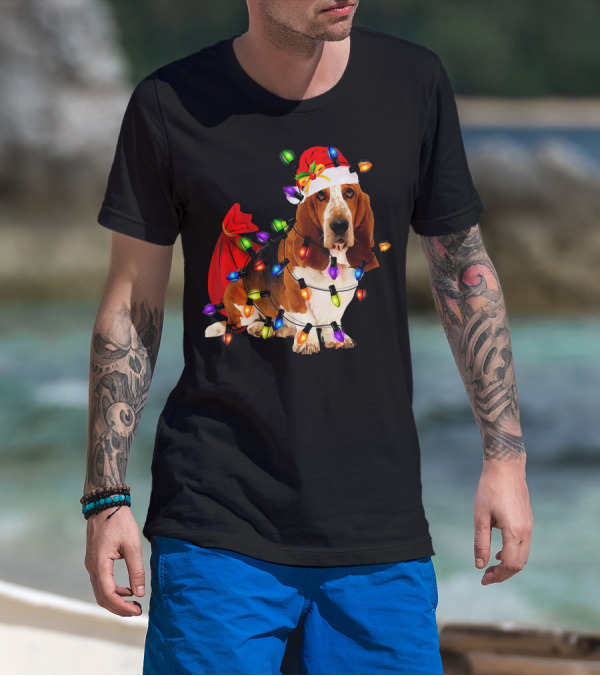 Basset Hound Wrapped In Christmas Lights With Santa Hat And Red Sack T-Shirt