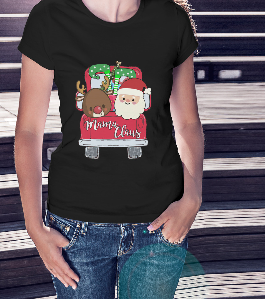 Woman with hands in pockets wearing Mama Claus Funny Christmas Car With Santa and Reindeer T-Shirt.